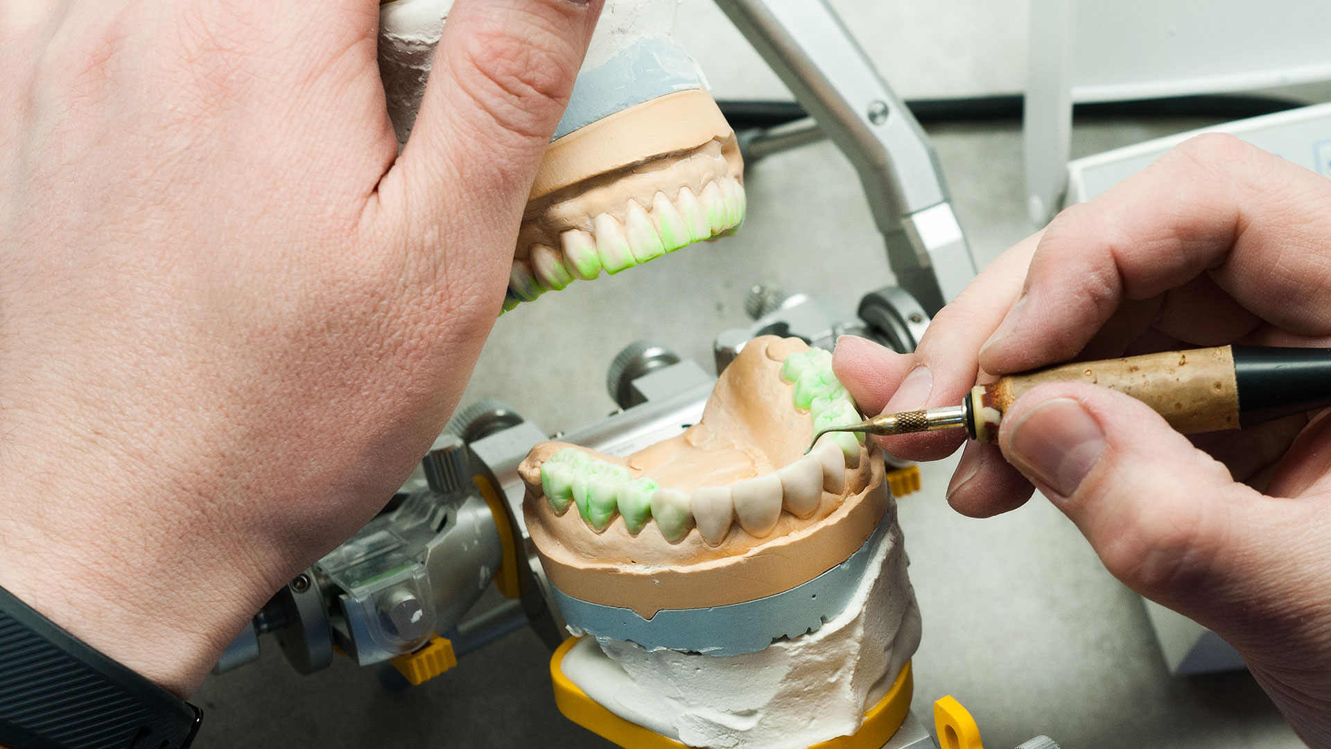 A dentist with dental assistant in modern dental surgery.