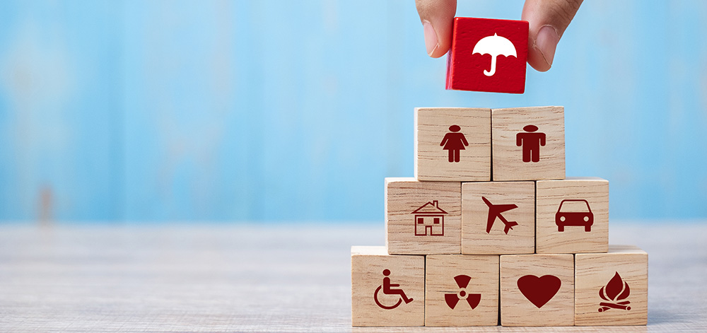 Hand holding umbrella wood block cover Insurance icon. healthcar